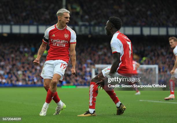 Leandro Trossard of Arsenal celebrates the opening goal with Bukayo Saka of Arsenal during the Premier League match between Everton FC and Arsenal FC...