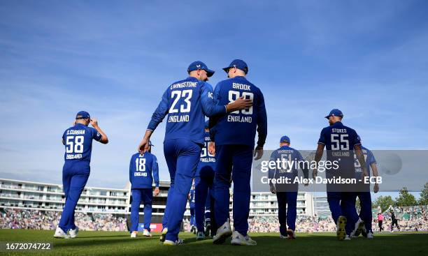 Liam Livingstone of England takes to the field with Harry Brook during the 2nd Metro Bank ODI between England and New Zealand at The Ageas Bowl on...