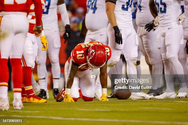 Isiah Pacheco of the Kansas City Chiefs kneels during an injury timeout during the third quarter against the Detroit Lions at GEHA Field at Arrowhead...
