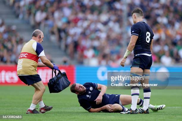 Finn Russell of Scotland requires medical attention having appeared to pick up an injury during the Rugby World Cup France 2023 match between South...