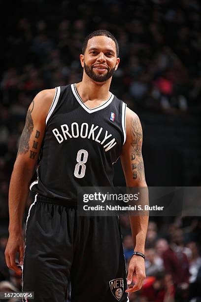 Deron Williams of the Brooklyn Nets smiles during the game against the Chicago Bulls in Game One of the Eastern Conference Quarterfinals during the...