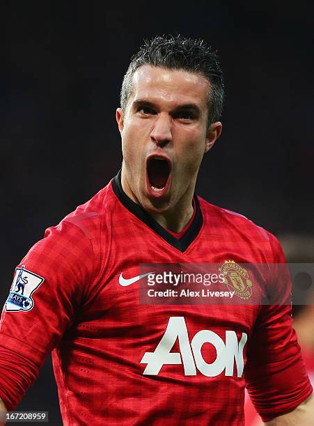 Robin van Persie of Manchester United celebrates scoring the opening goal during the Barclays Premier League match between Manchester United and...