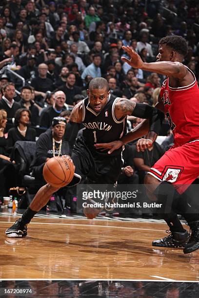 Watson of the Brooklyn Nets drives to the basket against Jimmy Butler of the Chicago Bulls in Game One of the Eastern Conference Quarterfinals during...