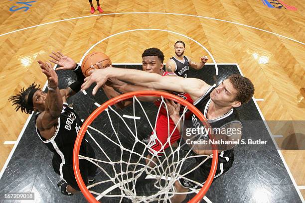 Brook Lopez of the Brooklyn Nets attempts to block a shot against Jimmy Butler of the Chicago Bulls in Game One of the Eastern Conference...