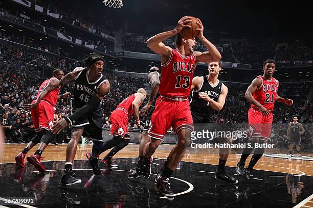 Joakim Noah of the Chicago Bulls grabs the rebound against the Brooklyn Nets in Game One of the Eastern Conference Quarterfinals during the 2013 NBA...