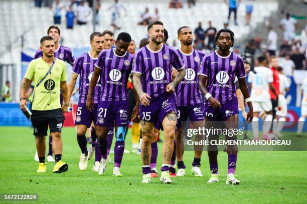 Toulouse's players react at the end of the French L1 football match between Olympique Marseille and Toulouse FC at Stade Velodrome in Marseille,...