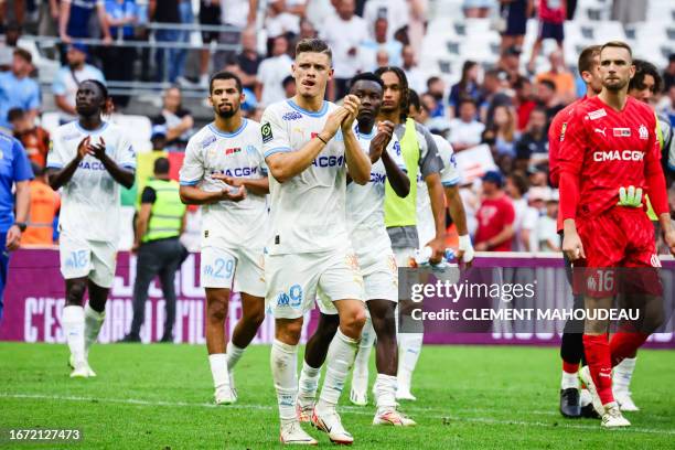 Marseille's Portuguese forward Vitor Manuel Carvalho De Oliveira and teammates react at the end of the French L1 football match between Olympique...