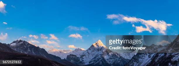 snowy mountain peak illuminated by sunlight idyllic wilderness panorama himalayas - kangtega stock pictures, royalty-free photos & images