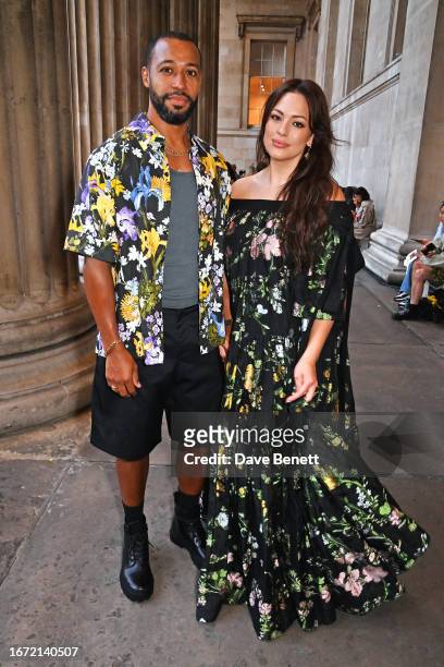 Justin Ervin and Ashley Graham attend the Erdem show during London Fashion Week September 2023 at The British Museum on September 17, 2023 in London,...