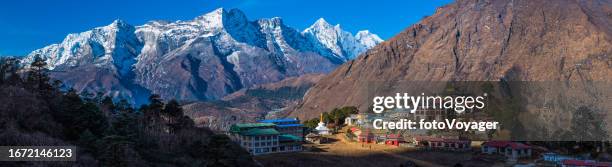 buddhist monastery high in himalayas overlooked by mountain panorama nepal - mt everest base camp stock pictures, royalty-free photos & images