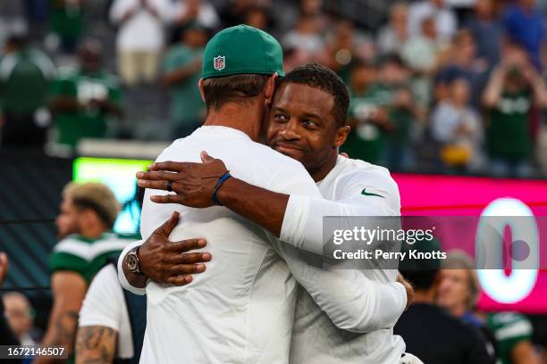 Aaron Rodgers and Randall Cobb of the New York Jets hug against the Tampa Bay Buccaneers prior to the game at MetLife Stadium on Saturday, August 19...