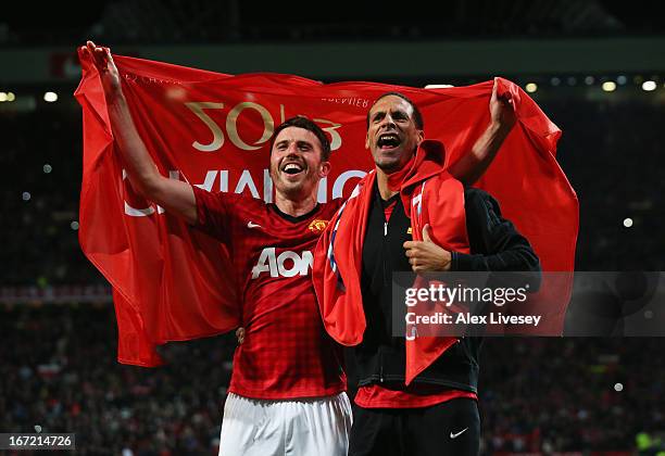 Michael Carrick and Rio Ferdinand of Manchester United celebrate winning the Premier League title after the Barclays Premier League match between...