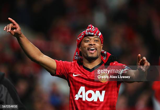 Patrice Evra of Manchester United celebrates victory and winning the Premier League title after the Barclays Premier League match between Manchester...