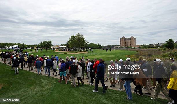 Fans walk to the ninth hold during the first round of the Demaret Division at the Liberty Mutual Insurance Legends of Golf at The Westin Savannah...