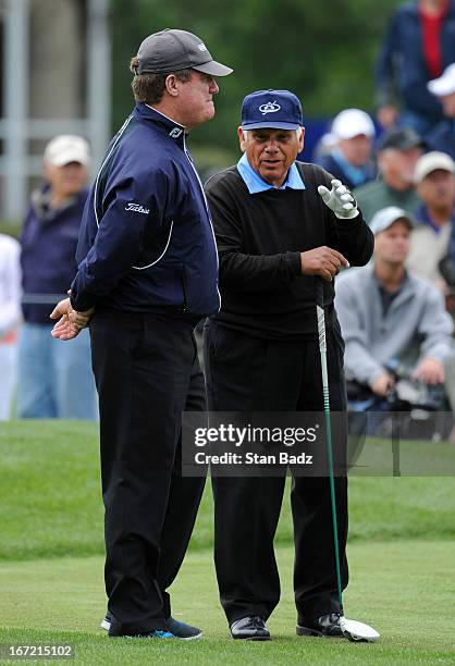 Steve Elkington and Lee Trevino watch play on the tenth hole during the first round of the Demaret Division at the Liberty Mutual Insurance Legends...