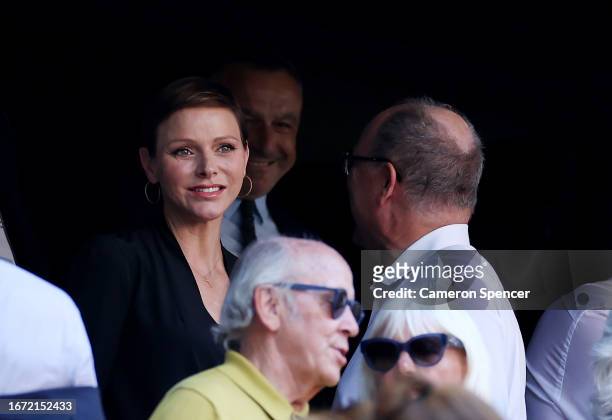 Charlene, Princess of Monaco, speaks with Albert II, Prince of Monaco, as they enjoy the pre-match atmosphere prior to the Rugby World Cup France...