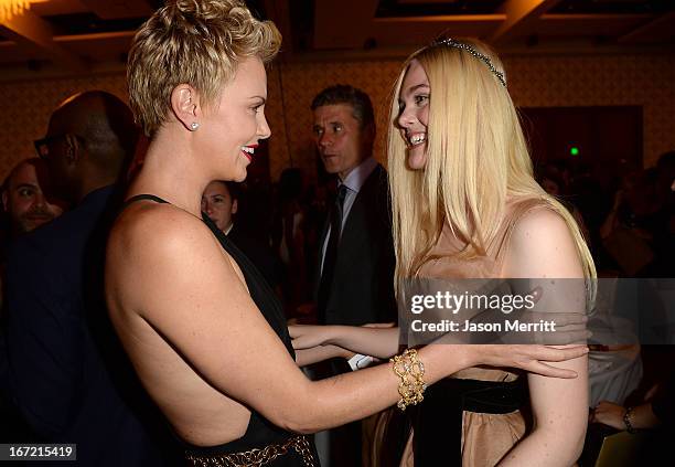 Actresses Charlize Theron and Elle Fanning attend the 24th Annual GLAAD Media Awards at JW Marriott Los Angeles at L.A. LIVE on April 20, 2013 in Los...