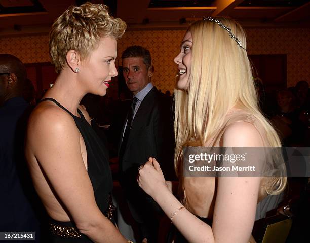Actresses Charlize Theron and Elle Fanning attend the 24th Annual GLAAD Media Awards at JW Marriott Los Angeles at L.A. LIVE on April 20, 2013 in Los...