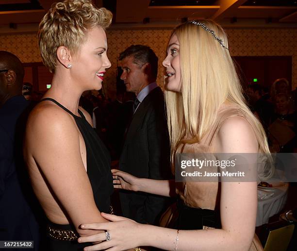 Actresses Charlize Theron and Elle Fanning attend the 24th Annual GLAAD Media Awards at JW Marriott Los Angeles at L.A. LIVE on April 20, 2013 in Los...