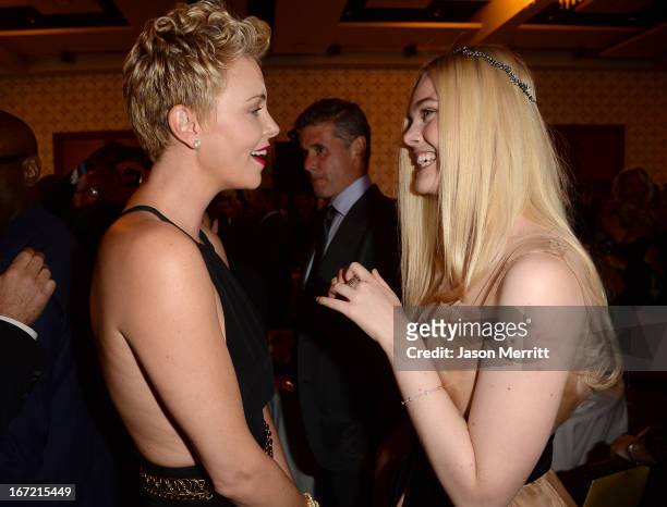 Actresses Charlize Theron and Elle Fanning attend the 24th Annual GLAAD Media Awards at JW Marriott Los Angeles at L.A. LIVE on April 20, 2013 in Los...