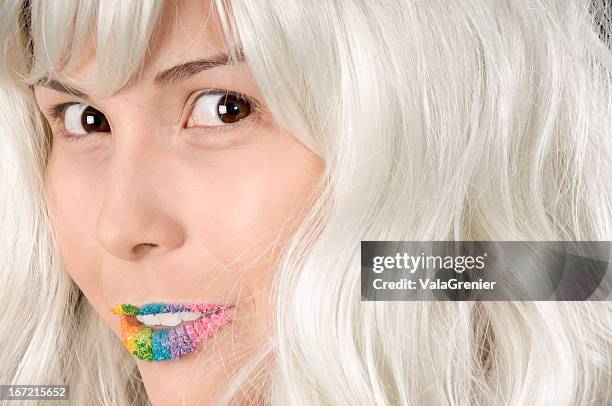model in white wig and candy lips with shy smile - candy lips stock pictures, royalty-free photos & images