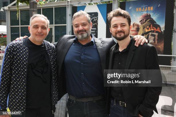 Producers Mohamed Hefzy, Majed Z. Samman and Director of "Hajjan" film Abu Bakr Shawky enjoy Festival Street activities at the 2023 Toronto...