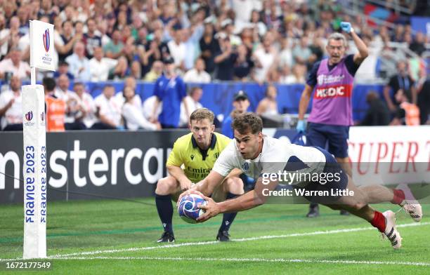 Damian Penaud of France scores his team's second try during the Rugby World Cup France 2023 match between France and New Zealand at Stade de France...