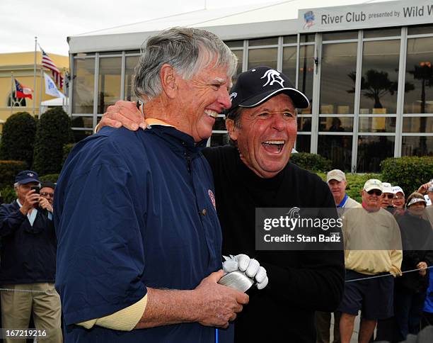 Mike Hill and Gary Player laugh together on the first hole during the first round of the Demaret Division at the Liberty Mutual Insurance Legends of...