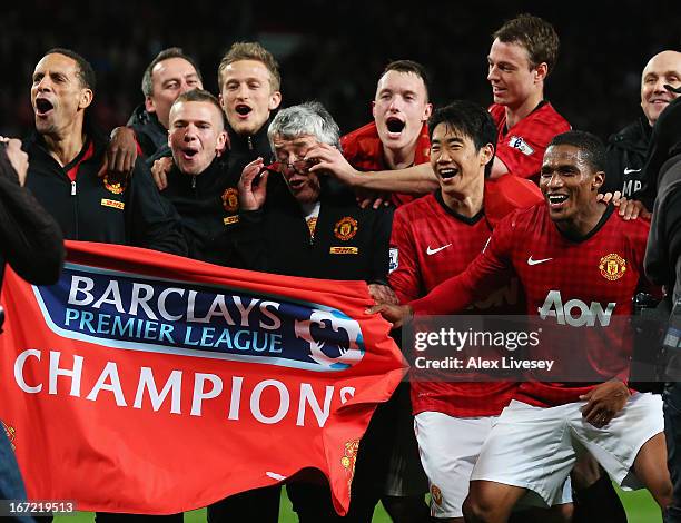 Rio Ferdinand, Tom Cleverley, Phil Jones, Shinji Kagawa, Jonny Evans and Antonio Valencia of Manchester United celebrate winning the Premier League...