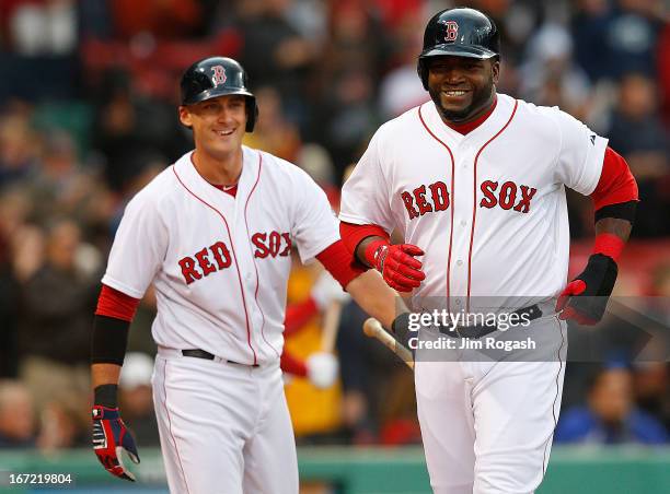 David Ortiz of the Boston Red Sox smiles after scoring a run in the 2nd inning as Will Middlebrooks of the Boston Red Sox looks against the Oakland...