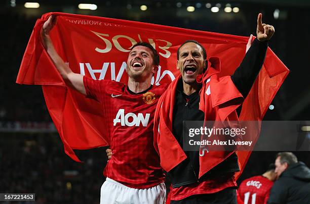 Michael Carrick and Rio Ferdinand of Manchester United celebrate winning the Premier League title after the Barclays Premier League match between...