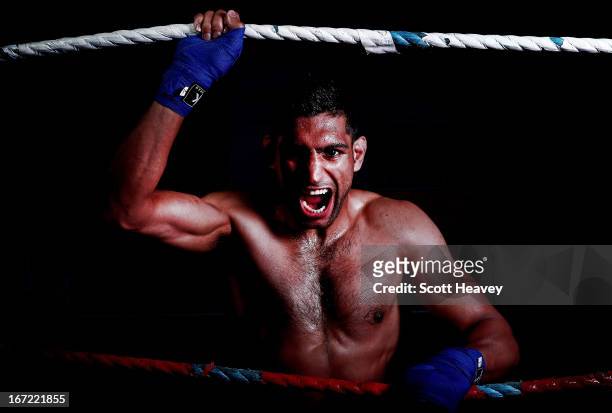Amir Khan poses during a photo shoot at Gloves Gym on April 22, 2013 in Bolton, England.