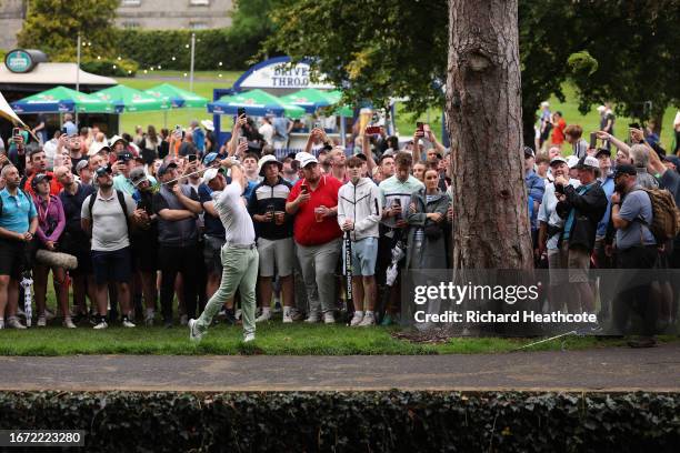 Rory McIlroy of Northern Ireland plays from the spectator village on the 16th hole during Day Four of the Horizon Irish Open at The K Club on...