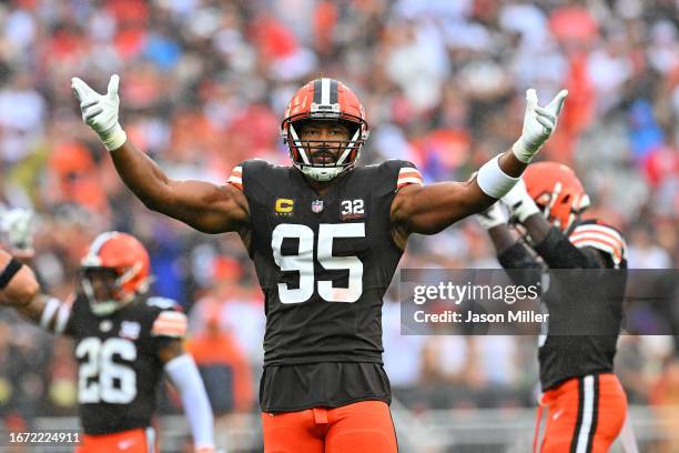 Myles Garrett of the Cleveland Browns gestures to the fans during the first half against the Cincinnati Bengals at Cleveland Browns Stadium on...