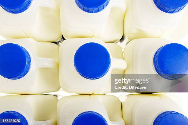 pint milk containers arranged in rows - mjölkflaska bildbanksfoton och bilder