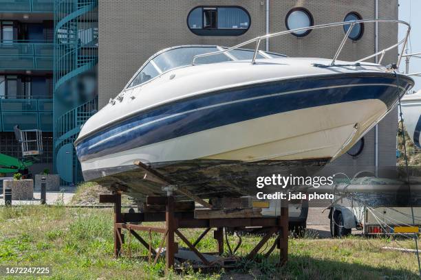 Speedboat Stands Outside On A Steel Structure High-Res Stock Photo