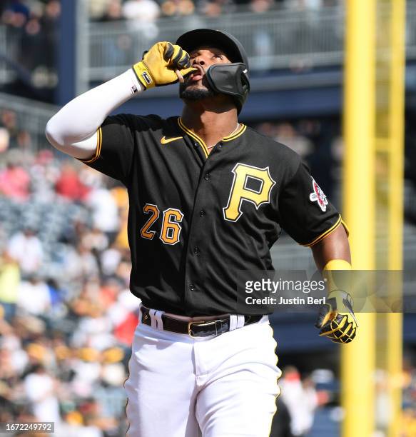 Miguel Andujar of the Pittsburgh Pirates reacts as he rounds the bases after hitting a solo home run in the fourth inning during the game against the...