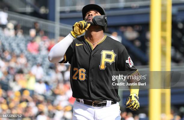 Miguel Andujar of the Pittsburgh Pirates reacts as he rounds the bases after hitting a solo home run in the fourth inning during the game against the...