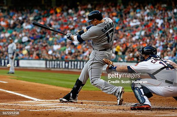Justin Smoak of the Seattle Mariners drives in a run in the first inning of the game against the Houston Astros at Minute Maid Park on April 22, 2013...