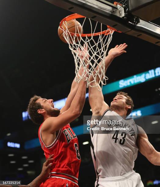 Kris Humphries of the Brooklyn Nets stops Marco Belinelli of the Chicago Bulls during Game Two of the Eastern Conference Quarterfinals of the 2013...