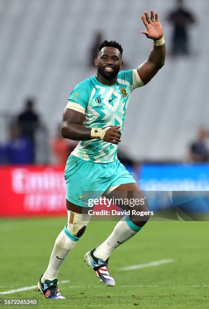 Siya Kolisi of South Africa waves to the fans in celebration at full-time following the Rugby World Cup France 2023 match between South Africa and...