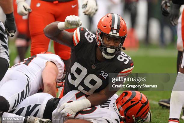 Za'Darius Smith of the Cleveland Browns celebrates a tackle on Joe Mixon of the Cincinnati Bengals during the first half at Cleveland Browns Stadium...