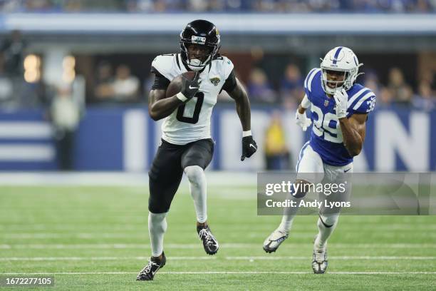 Calvin Ridley of the Jacksonville Jaguars runs the ball up the field against Darrell Baker Jr. #39 of the Indianapolis Colts in the second quarter of...