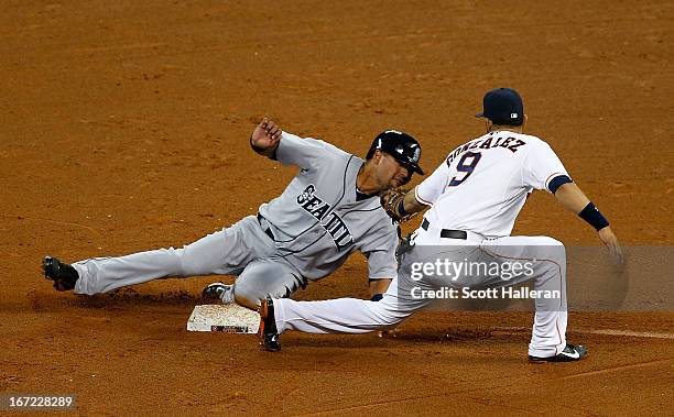 Franklin Gutierrez of the Seattle Mariners steals second in the fourth inning under the tag of Marwin Gonzalez of the Houston Astros at Minute Maid...