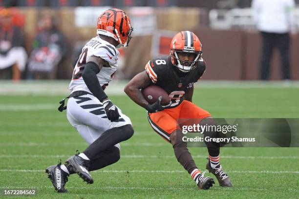 Elijah Moore of the Cleveland Browns runs the ball against Cam Taylor-Britt of the Cincinnati Bengals during the first half at Cleveland Browns...