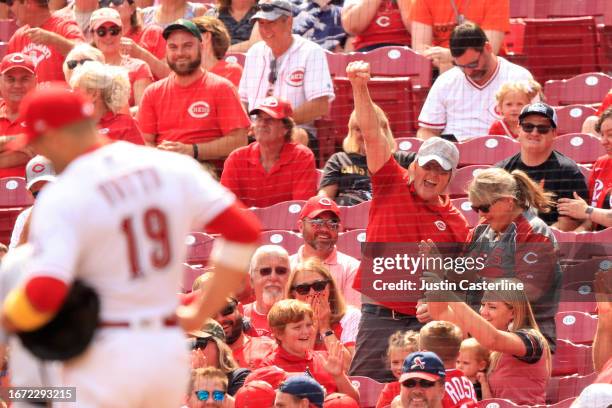 Cincinnati Reds fan reacts after catching a ball from Joey Votto of the Cincinnati Reds during the second inning against the St. Louis Cardinals at...