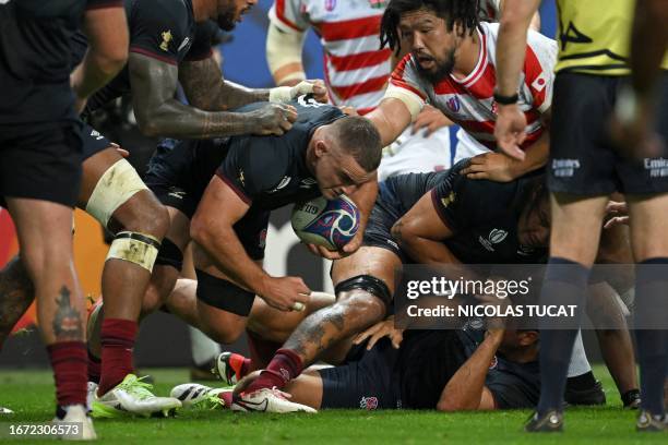 England's openside flanker Ben Earl runs with the ball after a ruck during the France 2023 Rugby World Cup Pool D match between England and Japan at...