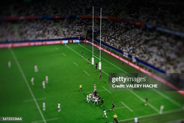 This photograph taken with a tilt and shift lens shows players fighting for the ball in a line out during the France 2023 Rugby World Cup Pool D...