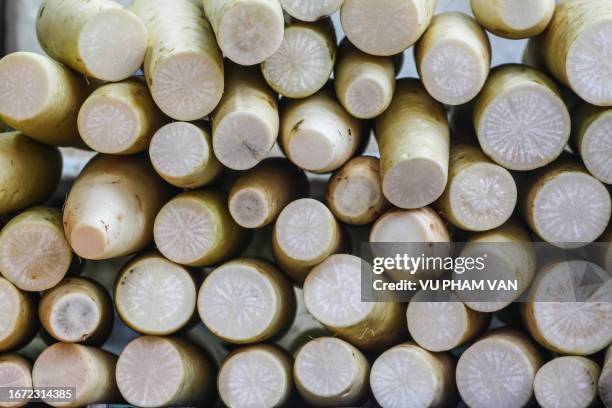 white radish root vegetables for sale at marketplace - daikon stock pictures, royalty-free photos & images