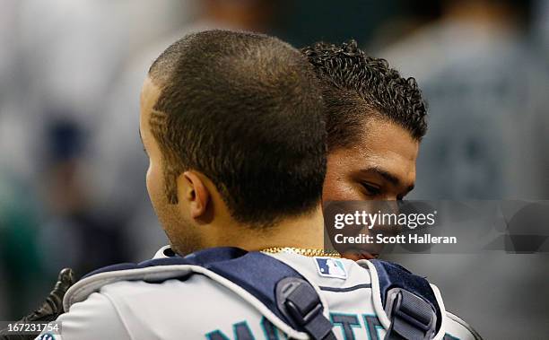 Felix Hernandez of the Seattle Mariners hugs his catcher Jesus Montero after pitching six scoreless innings in the game against the Houston Astros at...